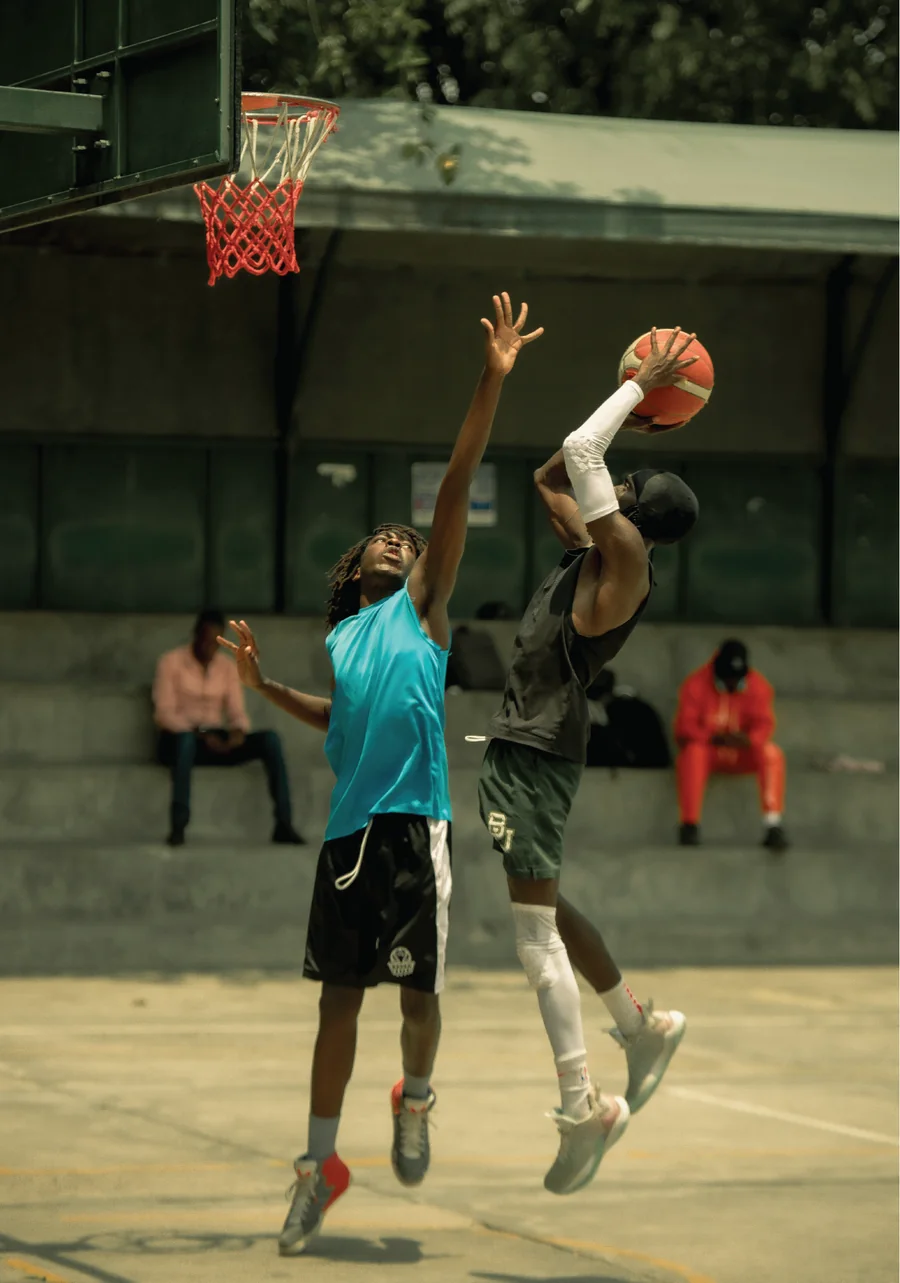 Two basketball players contesting a shot